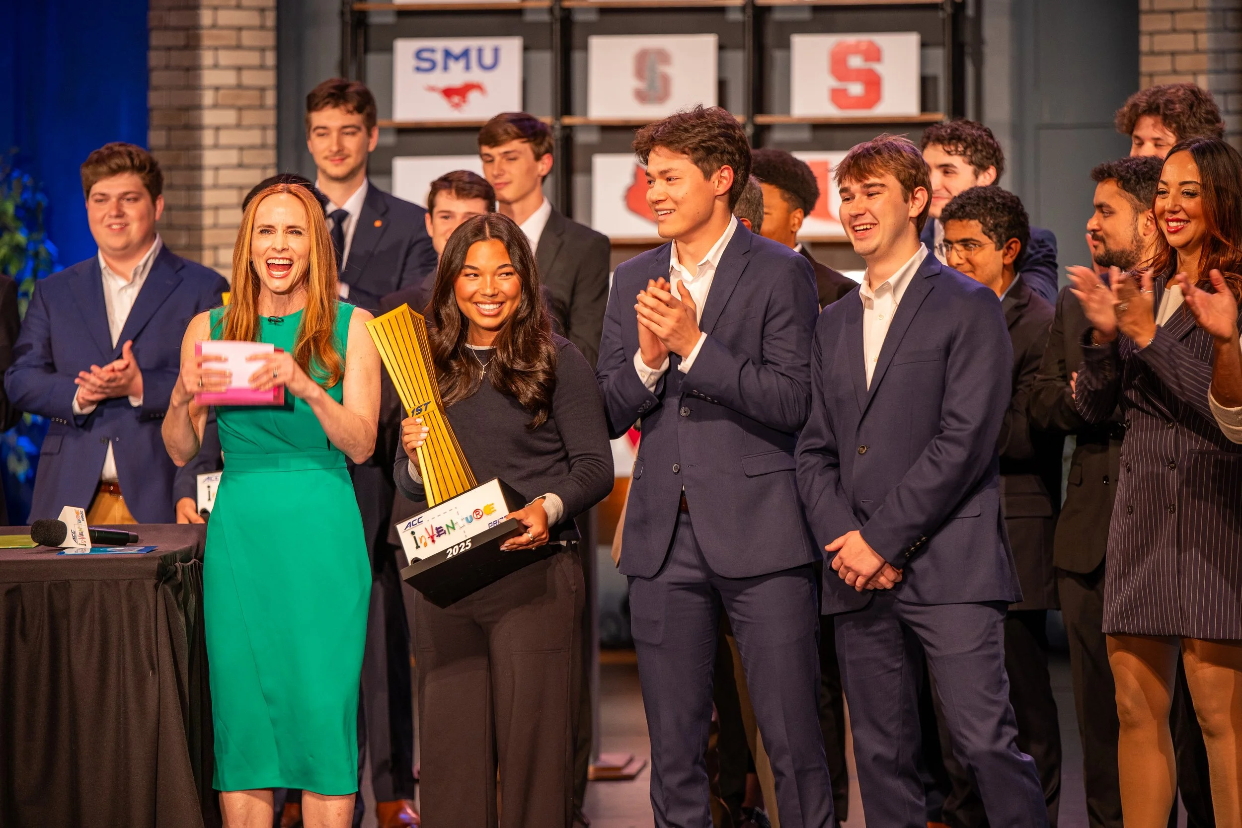 Student founder pitching on stage at a university pitch competition